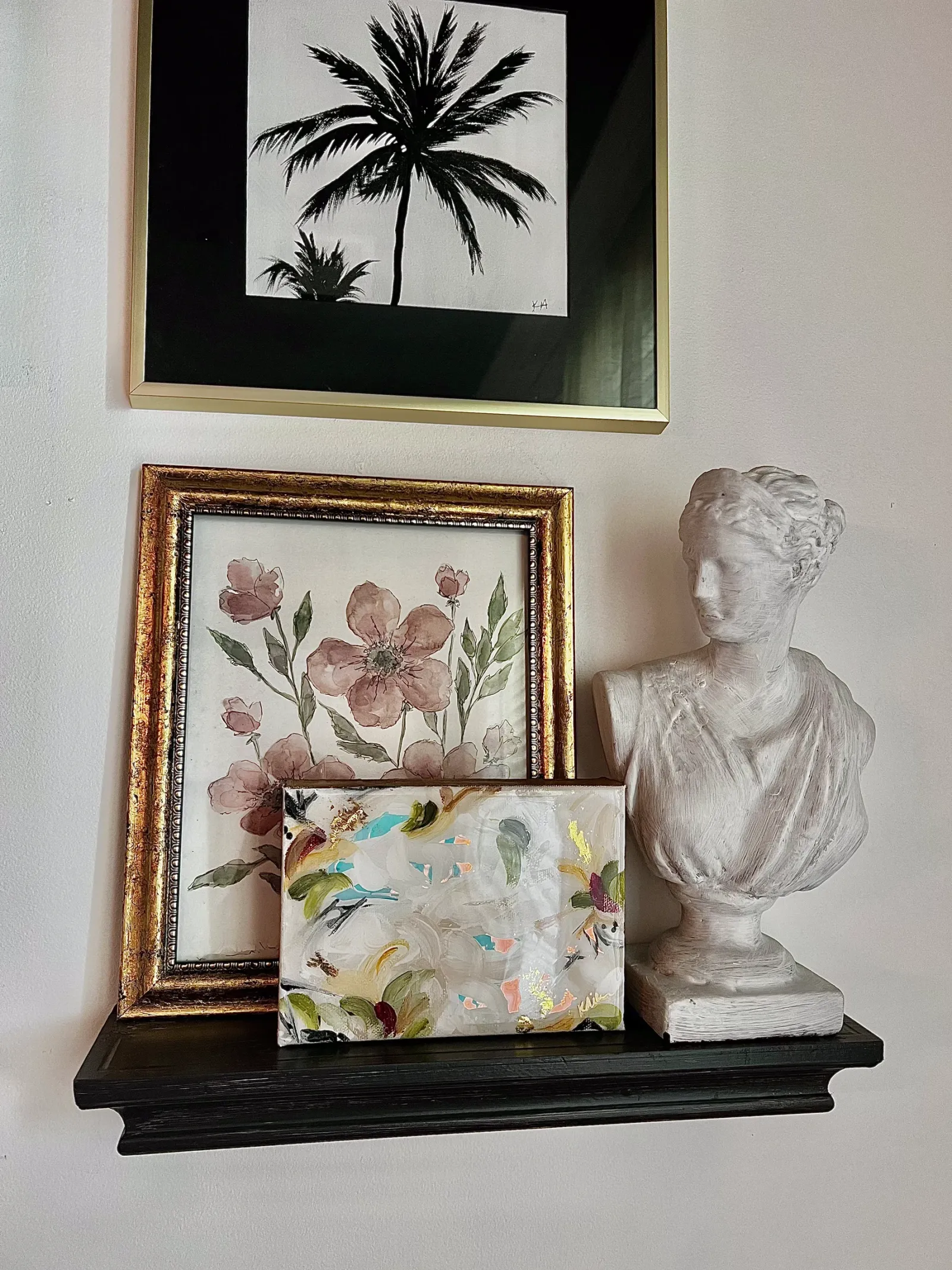 Watercolor florals, a palm study and a gilded mini canvas on a shelf